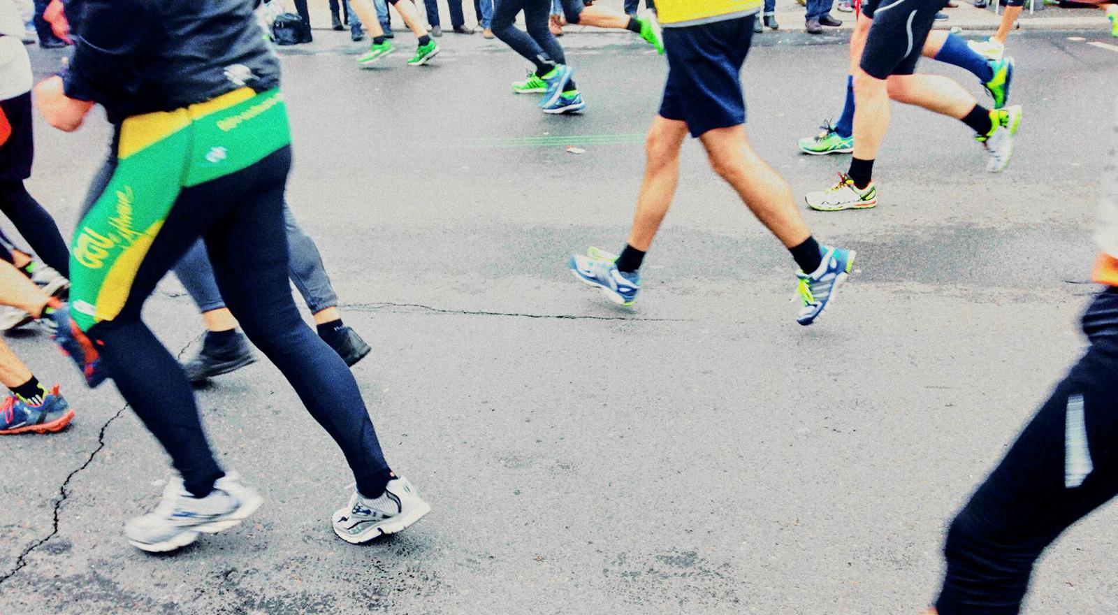 Large Web and Screen Low section of people's legs running a marathon on the street