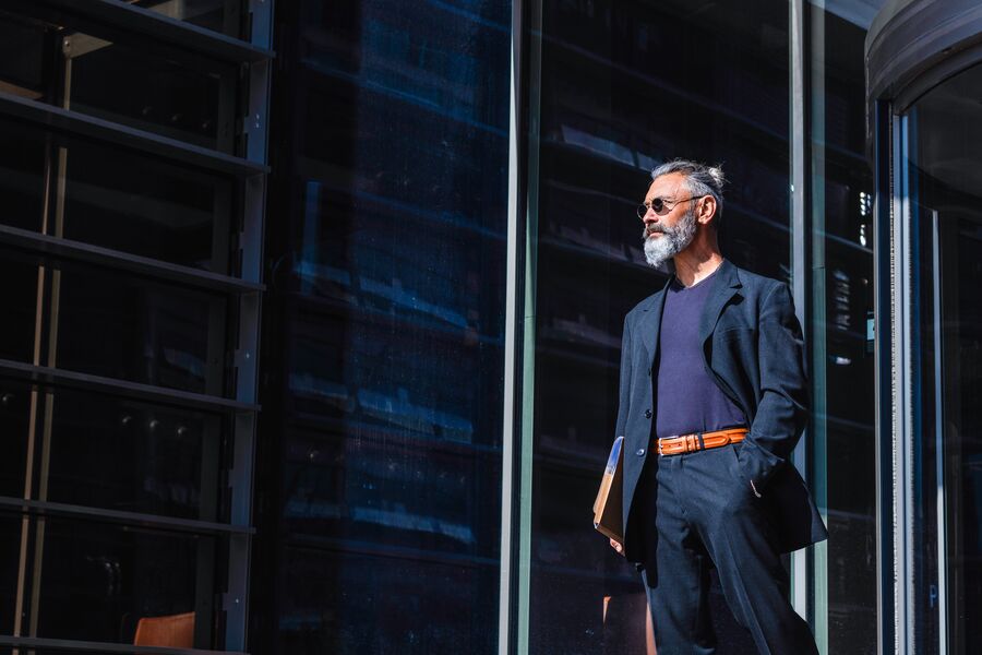 Mid adult businessman walking outdoors